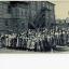 A black-and-white photograph of a large group of volunteers (comprised of women and children).