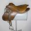 An English-style, brown leather saddle.