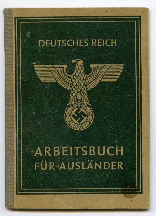 A small, softcover green booklet with the German eagle on top of a swastika  symbol on the cover.