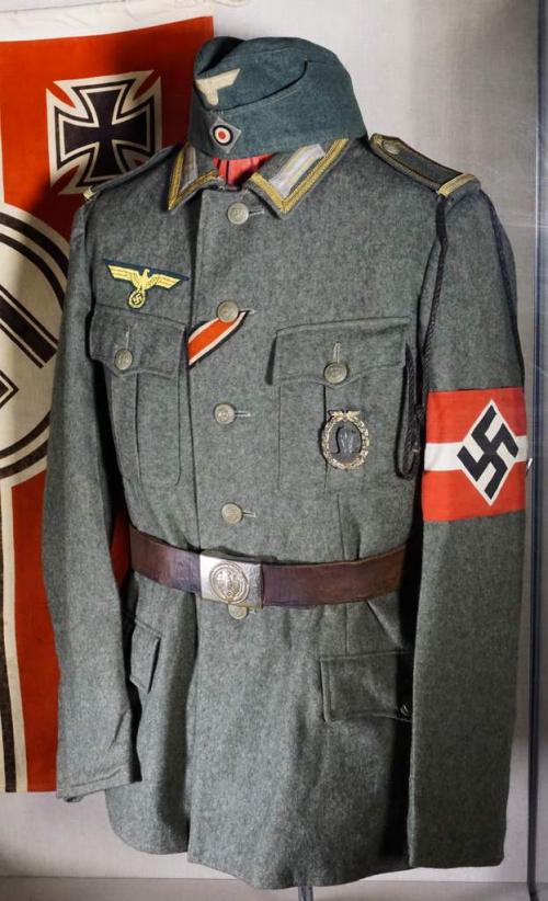 A grey wool tunic with a swastika armband.