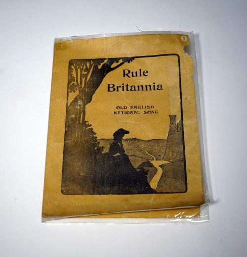 A folded, over-sized song sheet with the music for the song “Rule Britannia.”