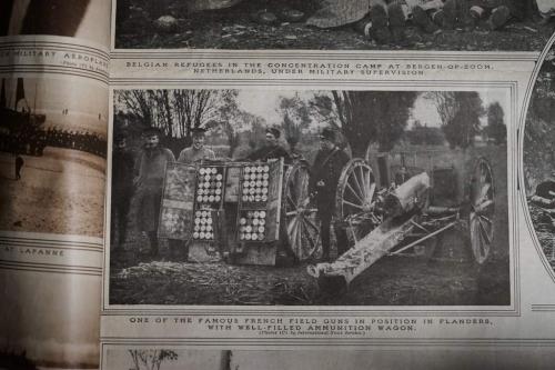 A black-and-white image of five French soldiers standing behind a wagon full of ammunition.