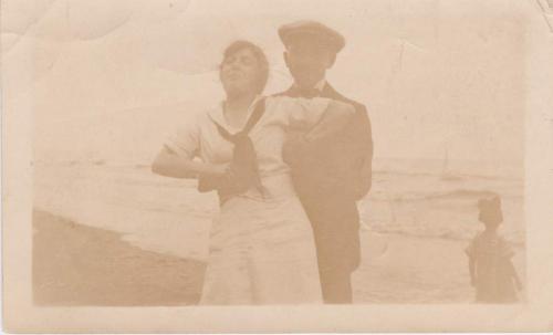 A sepia-toned image of Byron Cooper Sisler with Mildred Ramsden at a  beach.