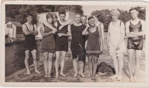 A black-and-white photograph of Byron Cooper Sisler with family and friends on a dock.