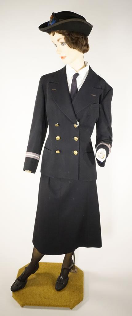A navy blue uniform consisting of a fitted jacket and knee-length skirt.