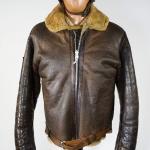 A brown leather bomber jacket with a thick lining.