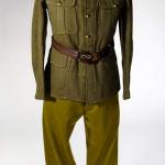 A mannequin wearing a soldier’s green khaki cap and an  undecorated tunic.