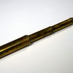 An extendable brass telescope.