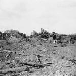 Alt text: A black-and-white photograph of a war-ravaged landscape