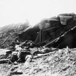 A black-and-white photograph of the bodies of dead German soldiers in a devastated landscape