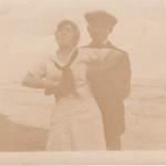 A sepia-toned image of Byron Cooper Sisler with Mildred Ramsden at a  beach.