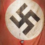 A classic red Nazi flag with the white circle with a black swastika in the center.