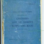 A blue hardcover book with pages on which to record a gunner’s flight  information.